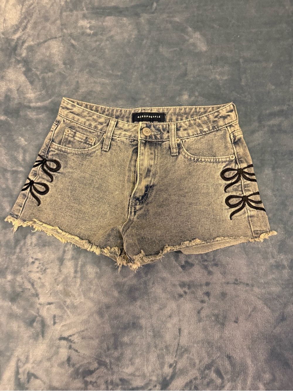 Aeropostale Light Wash Denim Shorts with Black Bow Accents